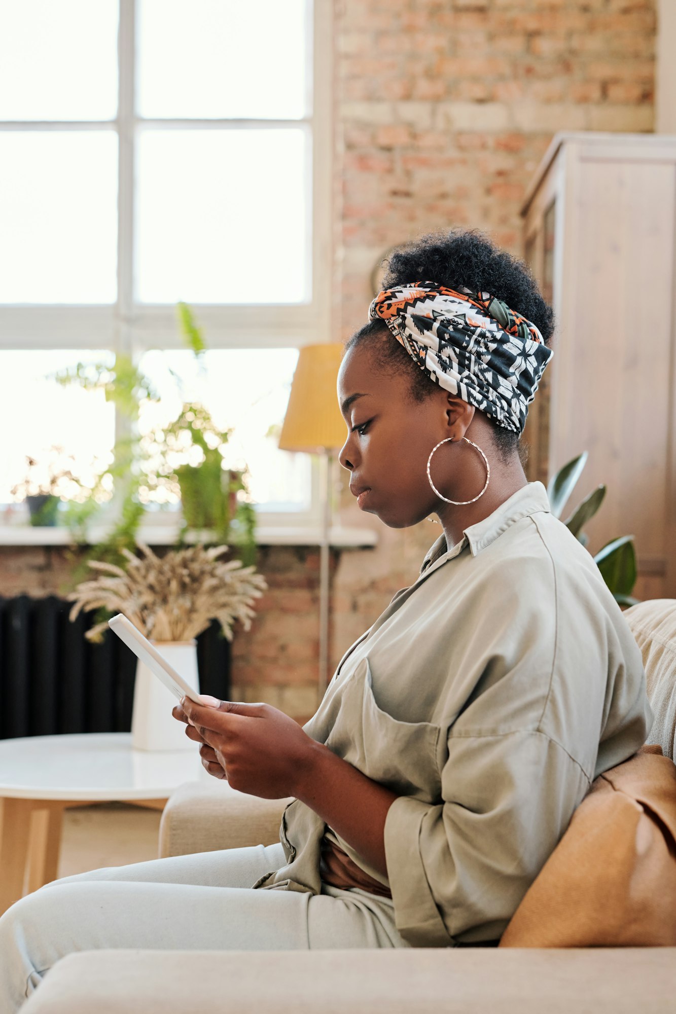 Serious black woman surfing internet